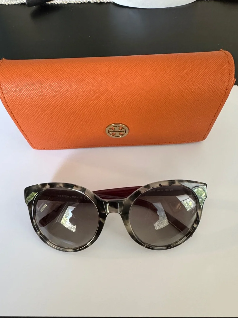 Tory Burch sunglasses.